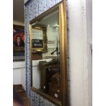 A gilt framed mirror