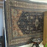 A blue ground Persian rug