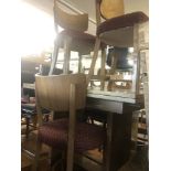 A walnut draw leaf table and six chairs