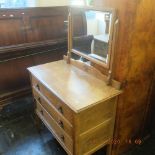 An oak wardrobe and matching dressing table