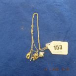 A silver Tiffany & Co necklace plus a yellow gold pendant on unmarked chain