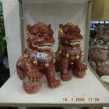 A pair of dogs of foo statues