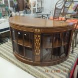 An inlaid mahogany demi lune side cabinet