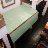 A retro kitchen table with drawer