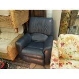A blue leather reclining arm chair
