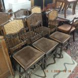 A set of six James Shoolbred & Co oak and cain dining chairs circa 1900