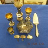 Eight assorted items of hallmarked silver including a pair of goblets and a pierced dish