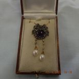 A necklace set with Cabochon amethyst, seed pearls,