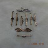 Nine assorted silver bar brooches