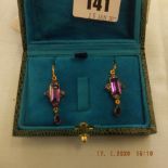 A pair of amethyst drop earrings