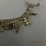 An early hm silver charm bracelet with 21 assorted very fine charms,