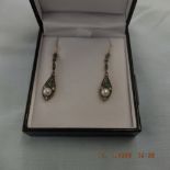 A pair of drop earrings set with diamond,