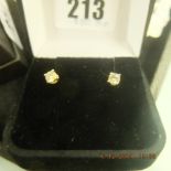 A pair of 18ct gold and diamond stud earrings approximately 0.