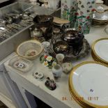 A mixed assortment of items of silver plate and porcelain, including a silver plated hip flask,