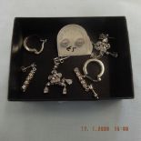 Four pairs of assorted silver earrings
