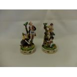 A pair of 19th century porcelain figures in 18th century costume,