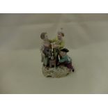 A hand painted Dresden porcelain figural group of children,