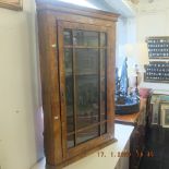 A walnut corner cabinet