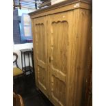 A 19th century pine double wardrobe.