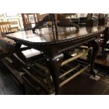 A mahogany extending dining,