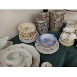 A collection of children's plates and bowls