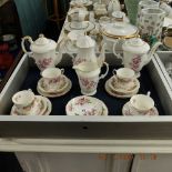 A floral decorated porcelain part coffee set