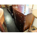 An antique mahogany chest of drawers