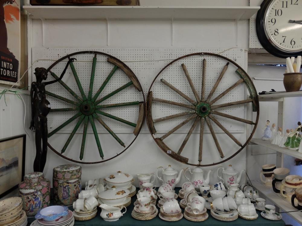 Two Victorian wheels and a old ladder