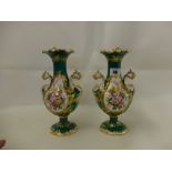 A pair of 19th Copeland porcelain vases hand painted on a green ground with floral decoration some
