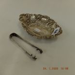 A hallmarked silver pierced bonbon dish and a pair of Russian cast silver 84 standard sugar tongs
