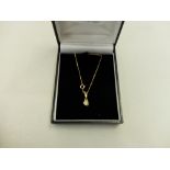 An 18ct gold diamond set pendant on 9ct chain