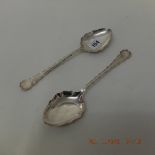 A pair of hallmarked silver dessert serving serving spoons,