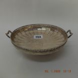 A hallmarked sterling silver footed, pierced bowl.