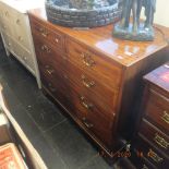 A 19th century mahogany, inlaid two over three chest of drawers.