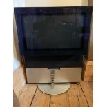 A Bang & Olufsen television and remote