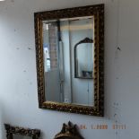 A gilt framed mirror