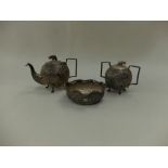 A late 19th century white metal Indian three piece tea service weight 634 grams
