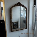 A gilt framed mirror