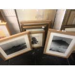 An assortment framed prints, photos,