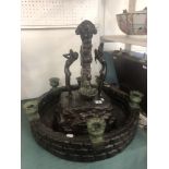 A bronze indoor fountain