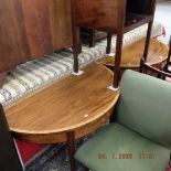 A pair of inlaid demi lune tables