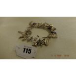 An early hm silver charm bracelet with 21 assorted very fine charms,