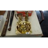 A large brass ashtray,