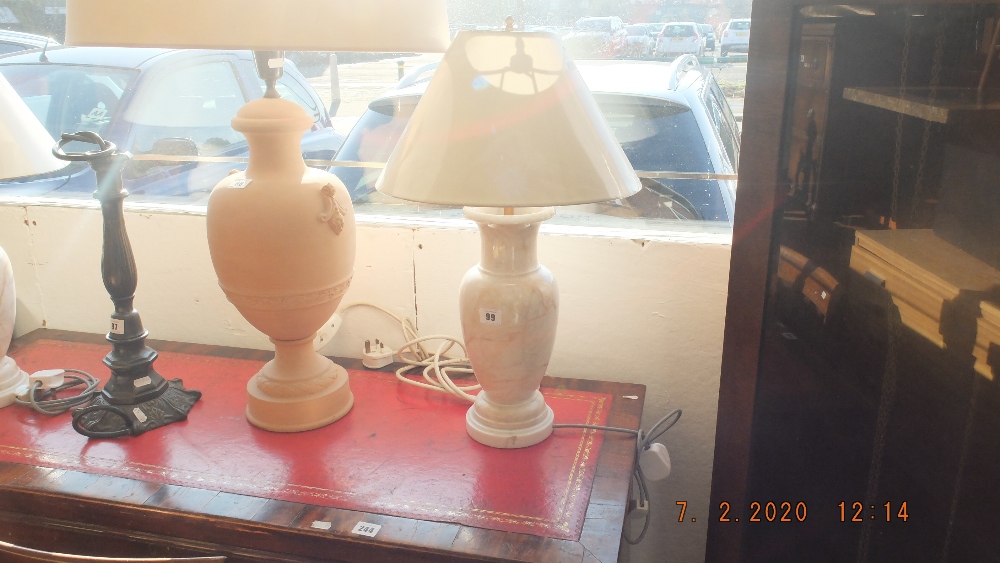 A pair of marble lamps and shades