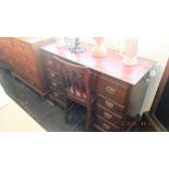 A mahogany pedestal desk with leather insert