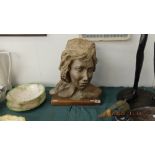 A decorative bust of a lady