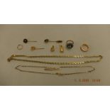 An assortment of yellow gold jewellery including chains and stick pins weight 47 grams