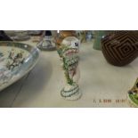 A hand painted porcelain vase of a hand holding a conch shell a/f