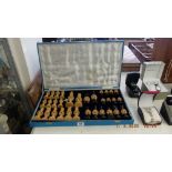 A chess set and board etc