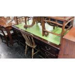 A large mahogany leather top desk